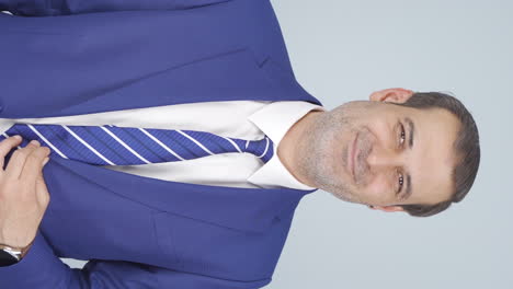 Vertical-video-of-Businessman-winking-at-camera.
